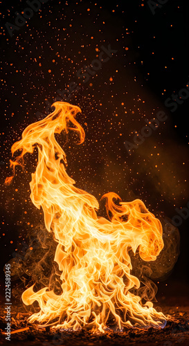 Fierce flames dancing against the night sky backdrop