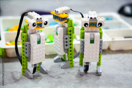 Three figures assembled from a plastic construction set