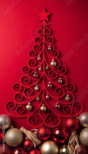 Ornamental Red Laser Cut Christmas Tree with Metallic Baubles Flat Lay Concept