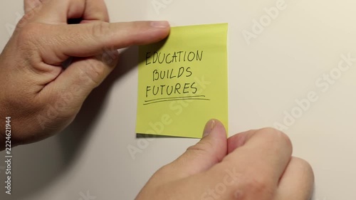 EDUCATION BUILDS FUTURES Message on a Yellow Sticky Note