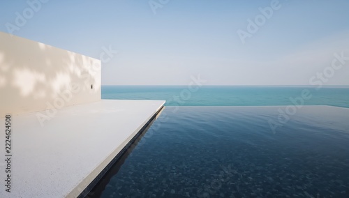 Minimalist Luxury Infinity Pool Overlooking the Serene Ocean at Modern Resort