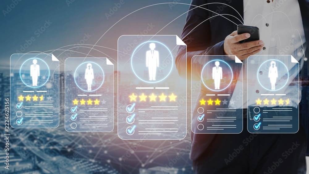 Obraz premium Professional Man Using Smartphone to Review Digital Employee Profiles with Ratings and Evaluations in Urban Background During Daytime Sigmoid