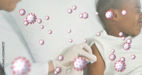 Giving doctor injecting child in tank-top at bed syringe white-coat gloves virus icons, copy space