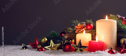 Christmas composition with a lantern, baubles and pine branche