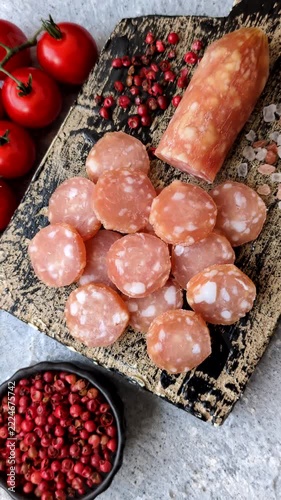 Sliced dry cured chicken sausage or smoked meat with salt and spices. Sliced smoked chicken sausage