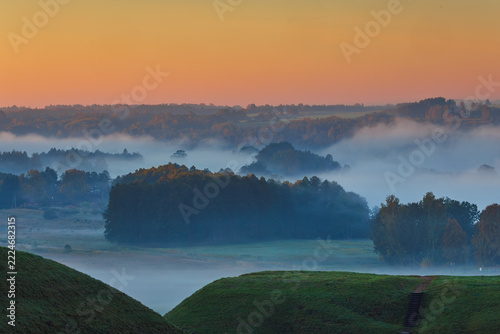 Fields covered in fog in Kernave, Lithuania