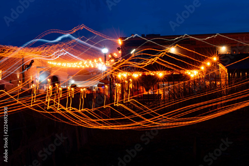 Long exposure intentional camera movement ICM abstract light trails of Halloween night street scene in Salem Massachusetts from The Burying Point Graveyard along Liberty Street