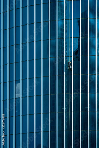 Vertical blue glass panels forming an abstract modern facade