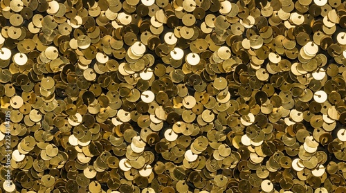 Seamless macro texture of glittering gold sequin fabric densely packed