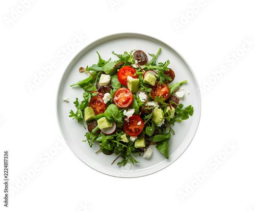 Fancy fresh salad loaded with organic greens, oven-dried tomatoes, radish, avocado, cucumber, and crumbly goat cheese