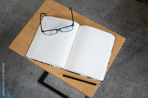 copy space flat lay. Notebook with glasses near. work from home, business concept