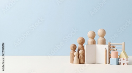 Wooden family figures and building blocks arranged with an abacus and notebook, representing childhood, education, and family life concepts
