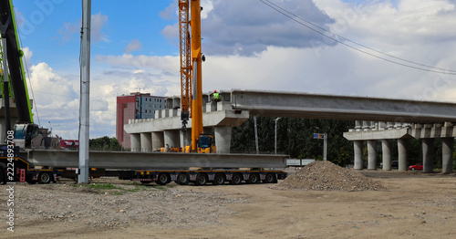 Construction of a two-level road interchange at Satpaev Avenue and Zhibek Zholy Street, with concrete flyovers and heavy equipment. Ust-Kamenogorsk (Kazakhstan)