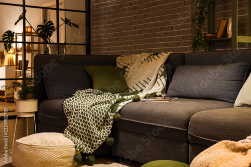 Cozy home interior with modern sofa and warm lighting, comfort and relaxation...