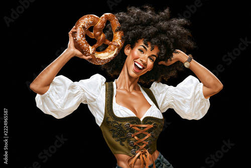 Illustration of smiling woman in dirndl holding beer mug and pretzel, Oktoberfest concept