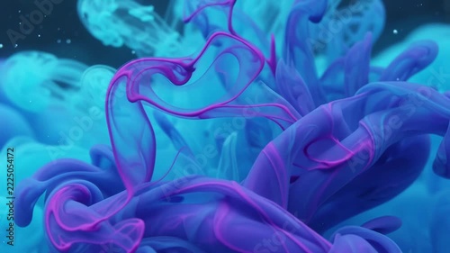 Blue and purple ink swirls through clear water creating dynamic abstract floral patterns.
