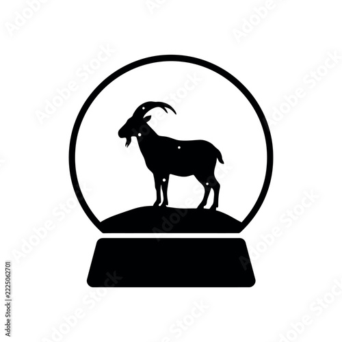 Goat silhouette inside Christmas snow globe