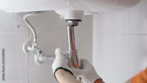 Repairing shink or washbasin drain.