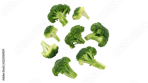 Obraz na plátně Scattered small green broccoli florets fresh vegetable pieces isolated on white