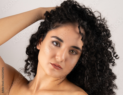 Beautiful Woman with Voluminous Natural Black Curly Hair on White Background, Beauty Portrait	