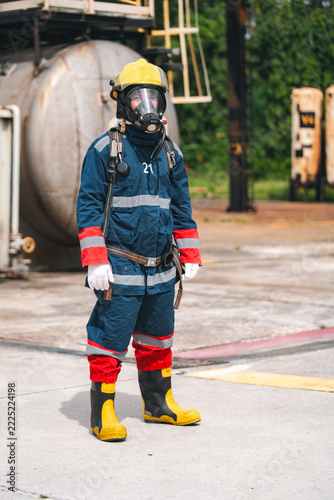 Firefighter rescue worker in protective gear prepares for fire disasters and accidents during emergency response training