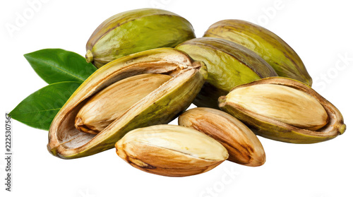 A close-up shot of several fresh nuts, some still in their green outer husks and others shelled, with a few green leaves scattered around.