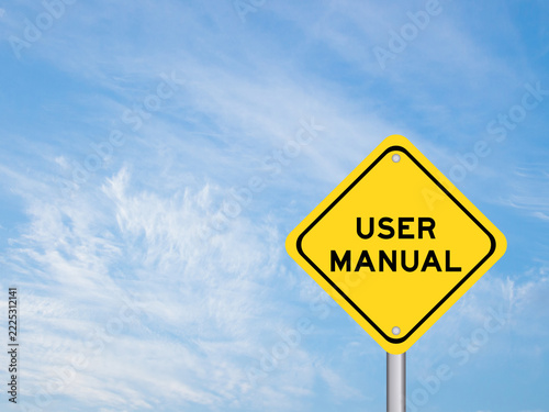 Yellow transportation sign with word user manual on blue color sky background