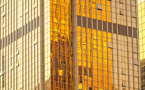 golden shining office tower building glass background Insulation modern building facade