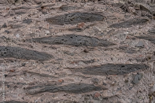 Welded tuff with flattened pumice fiamme in outcrop