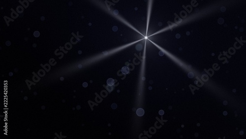 Bright six-ray star with silver beams and blue bokeh on dark navy