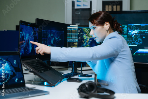 Professional monitoring aviation data on digital radar screens, analyzing flight tracking, aircraft navigation and advanced aerospace technology