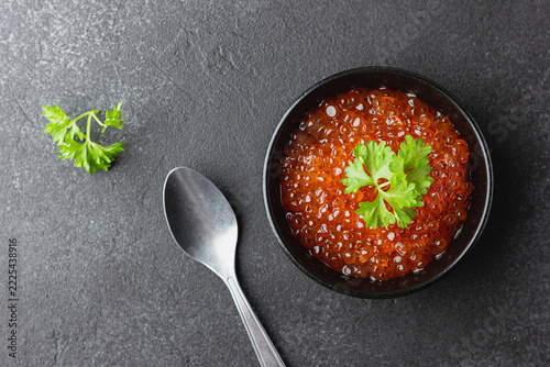 Red caviar with parsley in bowl