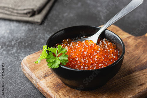 Red salmon caviar with parsley in a bowl