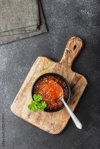 Red salmon caviar with parsley in a bowl