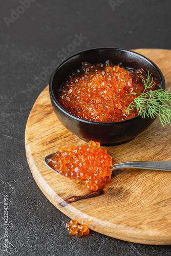 Red salmon caviar with dill in a bowl