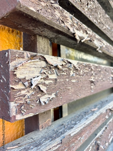Peeling Paint and Weathered Wood on an Old Wooden Structure
