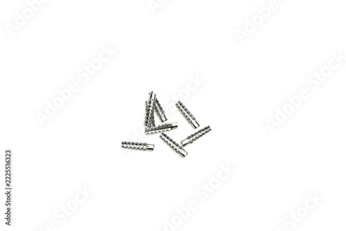 Metallic serrated split wall anchor inserts