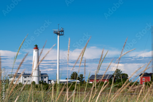 Finland. Marjaniemi Lighthouse, built in 1871 on the island of Hailuoto near the city of Oulu. A modern marine navigation radar system is located nearby.
