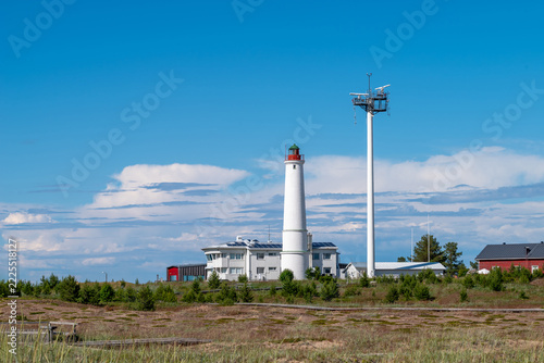 Finland. Marjaniemi Lighthouse, built in 1871 on the island of Hailuoto near the city of Oulu. A modern marine navigation radar system is located nearby.