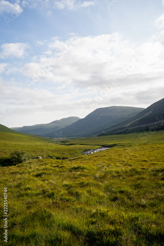Travelers in the rugged Glencoe mountain valley
