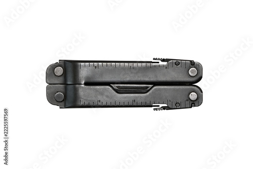 Closed black folding multitool with ruler markings and compact metal handles isolated on a transparent background