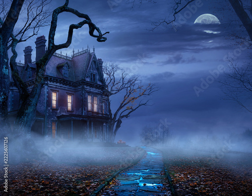 Fotografie Foggy Victorian Haunted Mansion Under Moonlit Halloween Sky