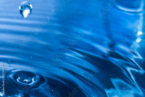 192.Mid-Air Droplet with Ripples on Deep Blue Water