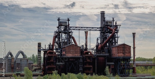 Photograph of massive production equipment in a decommissioned industrial facility