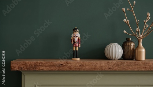 A wooden nutcracker sitting on a mantle, possibly as a decorative piece