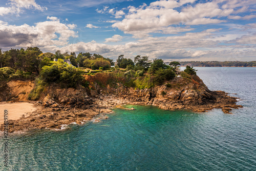 The beautiful French coastline along the Atlantic Ocean in Brittany, with rocks, azure water, and sand—a drone view.