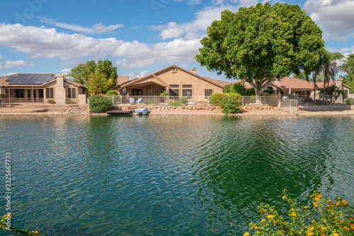 House backyards a lake in the neighborhoods Arizona.