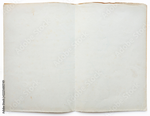 Old sheet paper folded in two, isolated on white background. Studio shot