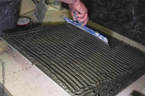 Skilled Craftsman Applying Trowel to Concrete with Expert Precision in Construction Project