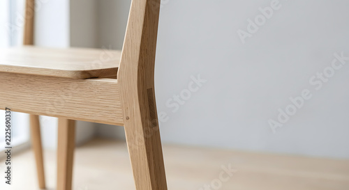 Minimalist wooden chair detail showing wood joinery and oak texture. Generative AI.